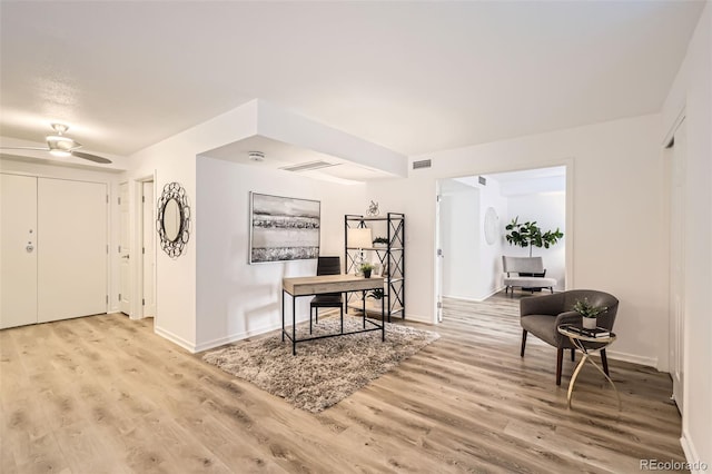 1551 Larimer St Unit 703, Denver, CO 80202 - foyer entrance with light wood-style flooring, baseboards, and a ceiling fan