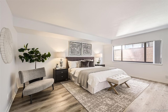 1551 Larimer St Unit 703, Denver, CO 80202 - bedroom featuring light wood-style floors and baseboards