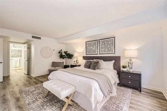 1551 Larimer St Unit 703, Denver, CO 80202 - bedroom featuring light wood-type flooring and baseboards