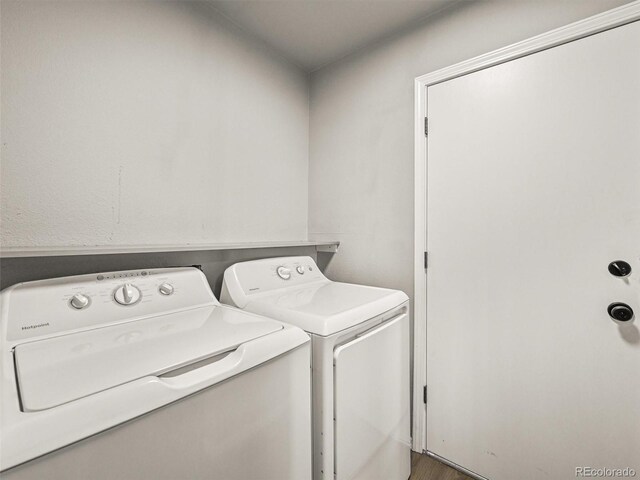 3535 Beechwood Ct, Colorado Springs, CO 80918 - laundry room featuring washer and clothes dryer and wood finished floors