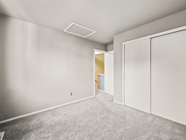 3535 Beechwood Ct, Colorado Springs, CO 80918 - unfurnished bedroom featuring attic access, carpet floors, a closet, and baseboards