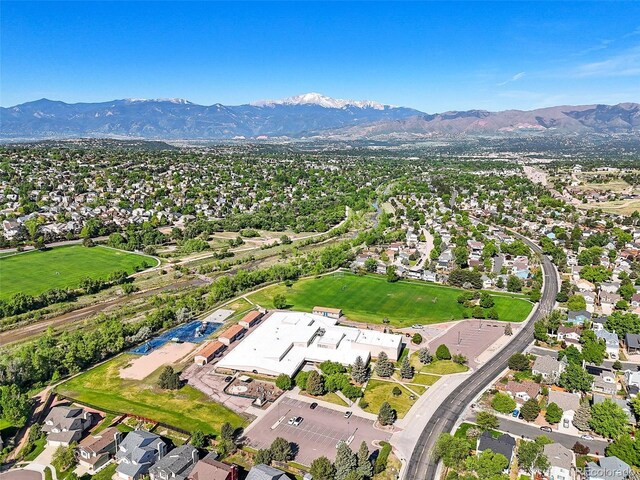 3535 Beechwood Ct, Colorado Springs, CO 80918 - aerial overview of property's location featuring mountains and nearby suburban area