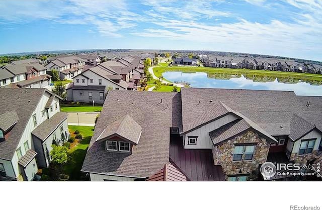 birds eye view of property featuring a residential view and a water view