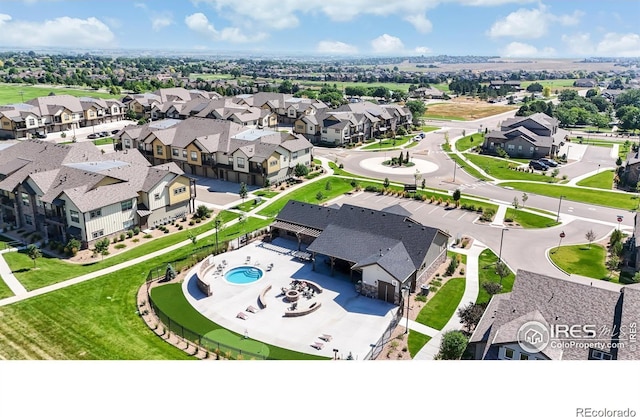 birds eye view of property with a residential view