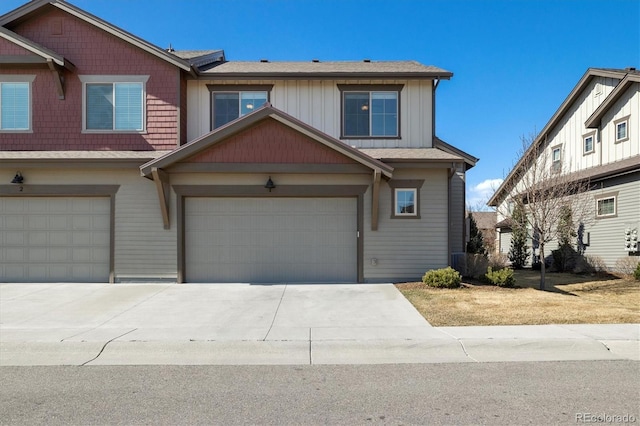 view of front of house featuring board and batten siding, an attached garage, and concrete driveway