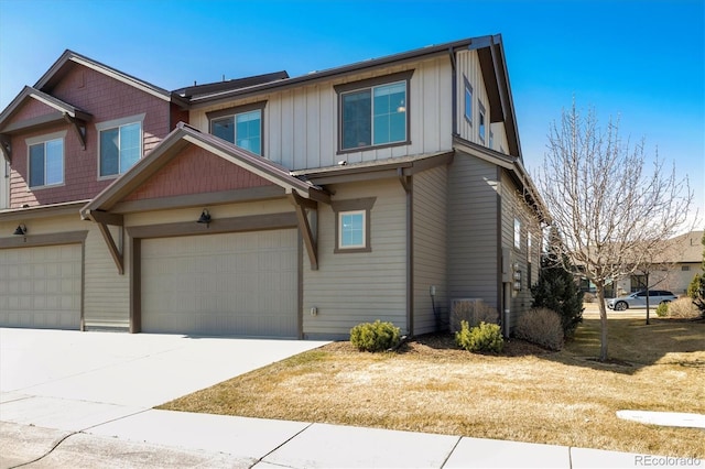 view of front of home featuring an attached garage, board and batten siding, and driveway