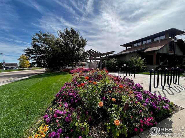 surrounding community featuring a pergola and a yard