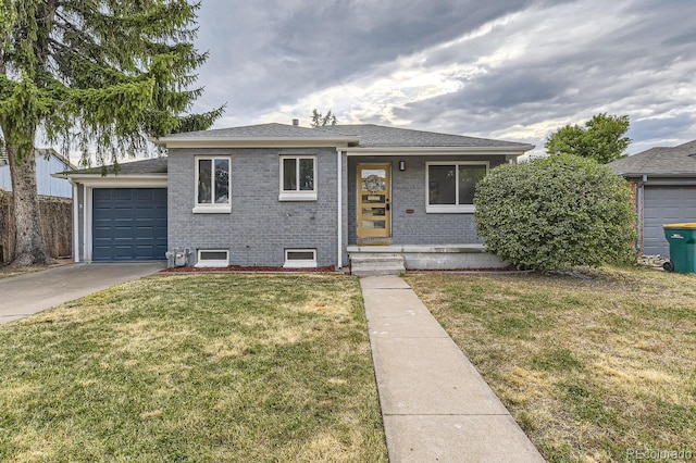 view of front of property with a front lawn and a garage