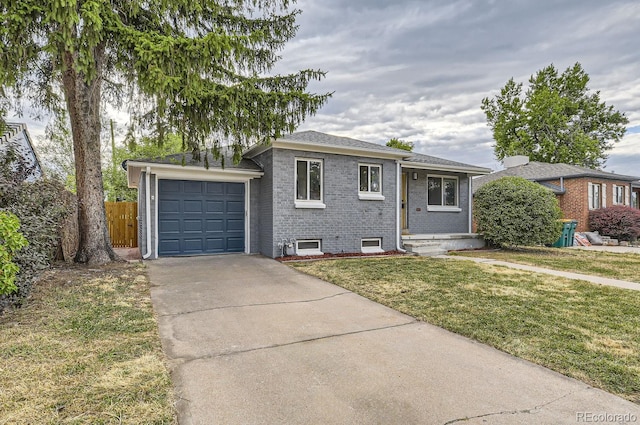 view of front facade with a garage and a front lawn