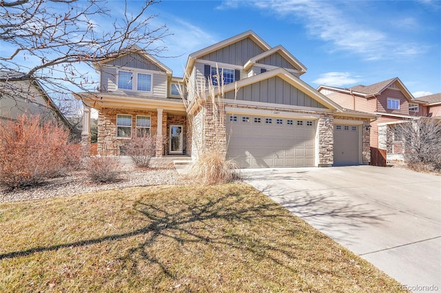 craftsman house featuring board and batten siding, concrete driveway, and stone siding