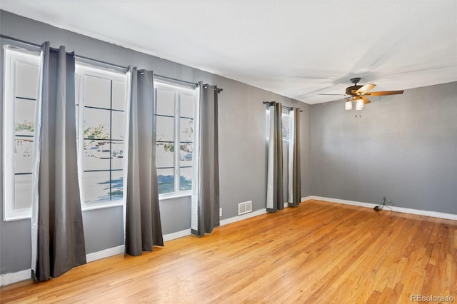 unfurnished room featuring light wood-type flooring and ceiling fan