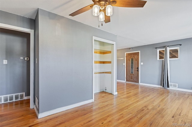 unfurnished room featuring ceiling fan and light hardwood / wood-style flooring