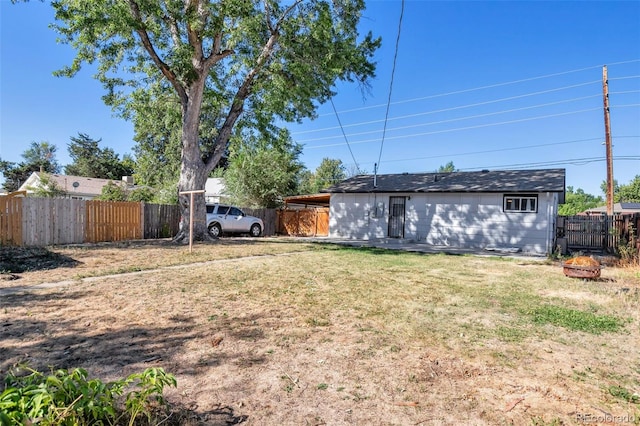 view of yard with an outdoor fire pit