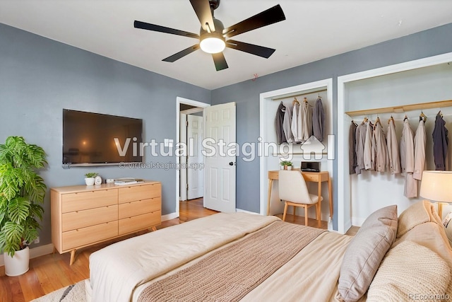 bedroom featuring light hardwood / wood-style floors, ceiling fan, and a closet