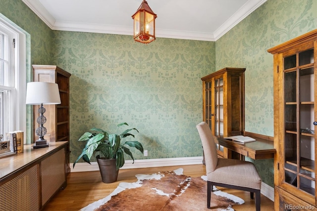 office featuring wallpapered walls, baseboards, wood finished floors, and ornamental molding