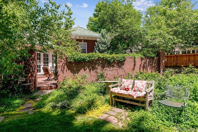 view of yard featuring a patio area and fence