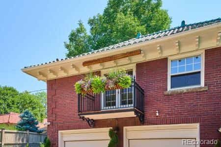 view of side of property with a garage and brick siding