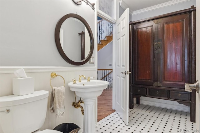 9880 E Progress Cir, Greenwood Village, CO 80111 - bathroom with crown molding, a wainscoted wall, toilet, and a sink