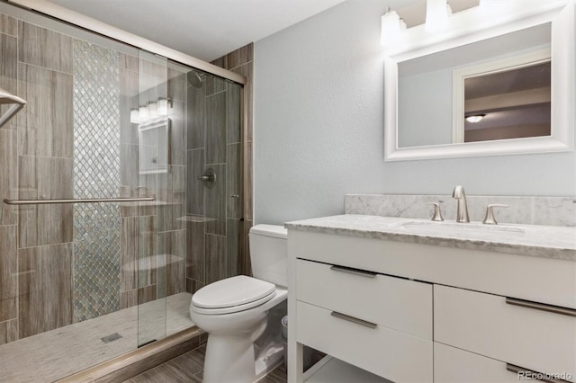 9880 E Progress Cir, Greenwood Village, CO 80111 - bathroom with toilet, a stall shower, and vanity