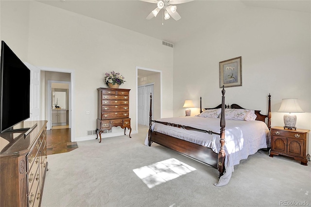 bedroom featuring light colored carpet, visible vents, ceiling fan, high vaulted ceiling, and baseboards