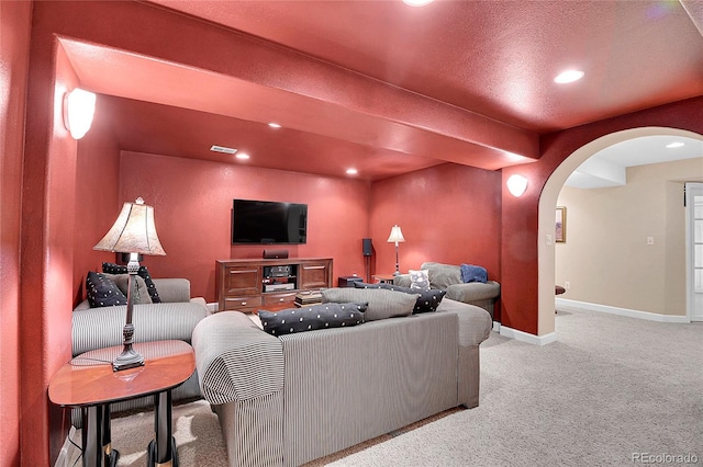 living room with light carpet, baseboards, arched walkways, and recessed lighting