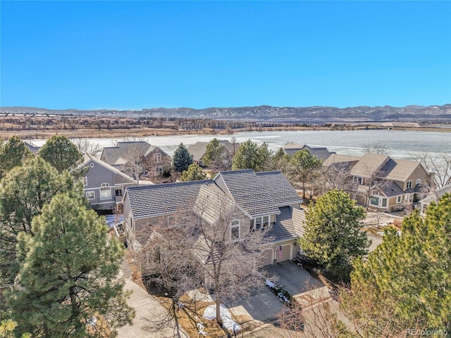 aerial view with a residential view and a water and mountain view