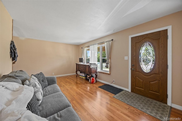 11192 E 7th Ave, Aurora, CO 80010 - foyer with healthy amount of natural light and wood finished floors