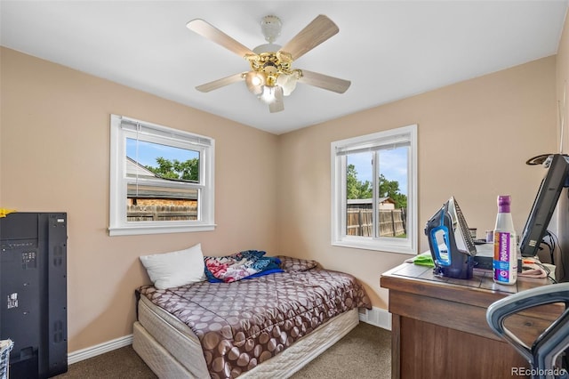 11192 E 7th Ave, Aurora, CO 80010 - carpeted bedroom featuring baseboards and a ceiling fan