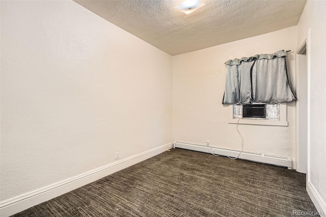 empty room featuring a textured ceiling, a baseboard radiator, cooling unit, and baseboards