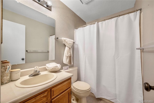 bathroom with vanity, curtained shower, a textured wall, a textured ceiling, and toilet