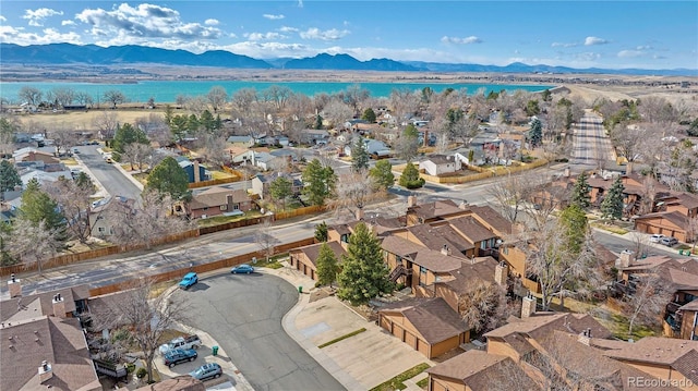 9411 W 89th Cir, Westminster, CO 80021 - aerial overview of property's location featuring nearby suburban area and a water and mountain view