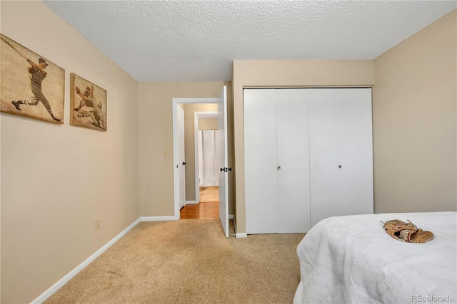 9411 W 89th Cir, Westminster, CO 80021 - carpeted bedroom with a closet and a textured ceiling