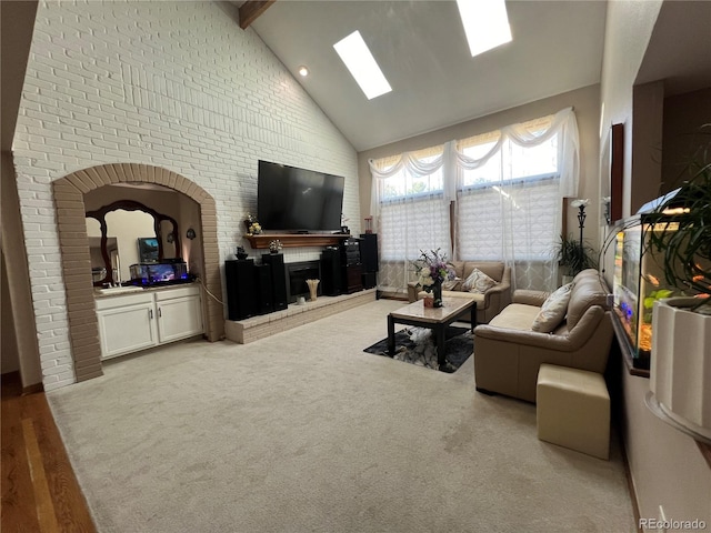 living room with hardwood / wood-style flooring, high vaulted ceiling, and beamed ceiling