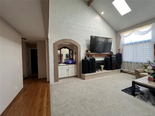 living room with lofted ceiling with beams and dark wood-type flooring