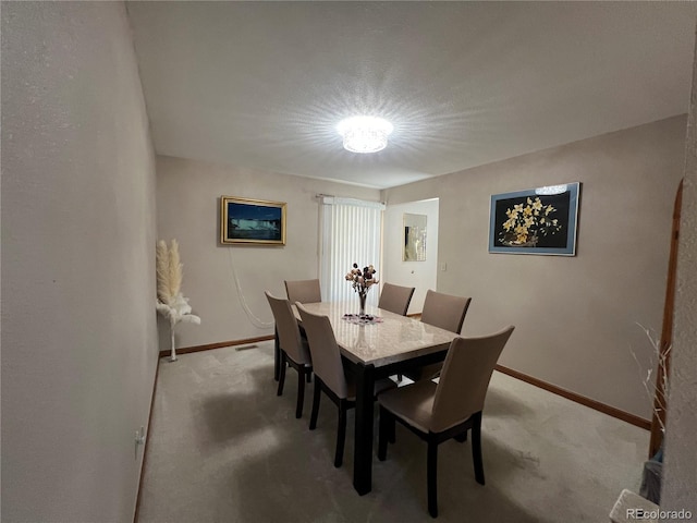 dining room with light carpet