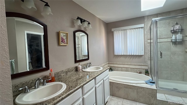 bathroom featuring vanity, shower with separate bathtub, and tile patterned floors