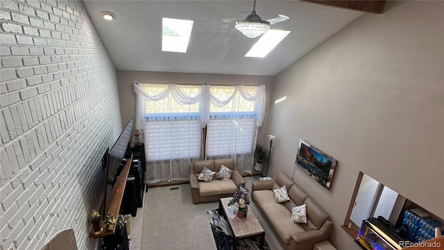 unfurnished living room with vaulted ceiling with skylight