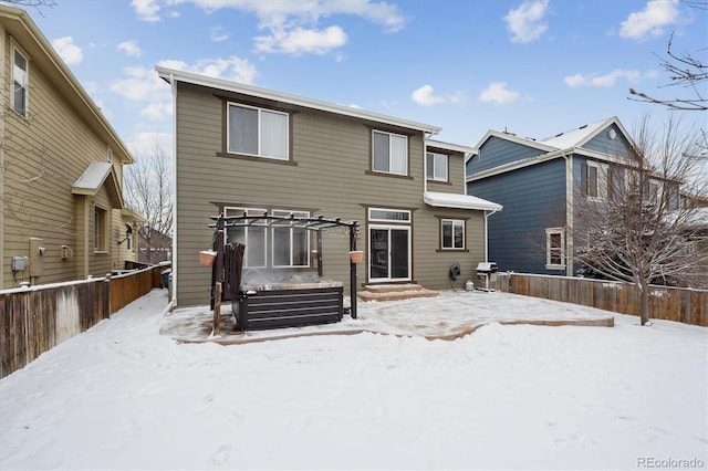 snow covered property with a pergola