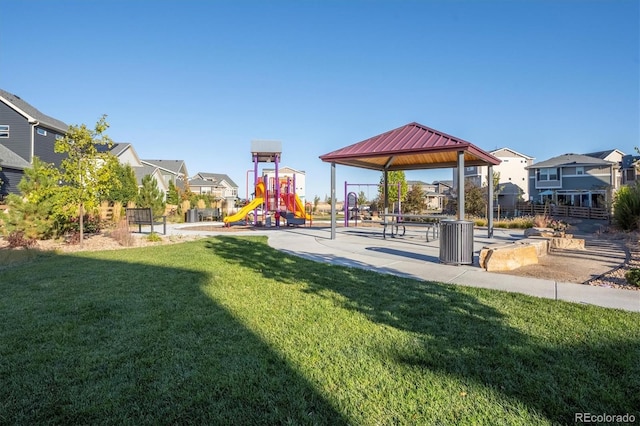 view of play area with a gazebo and a lawn