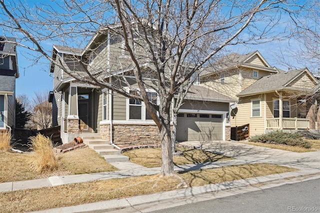 10251 Rifle St, Commerce City, CO 80022 - view of front of house featuring a garage, stone siding, and driveway