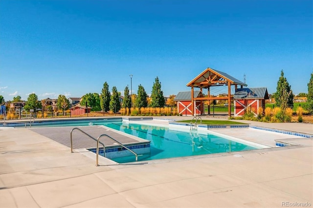 10251 Rifle St, Commerce City, CO 80022 - community pool featuring an outbuilding