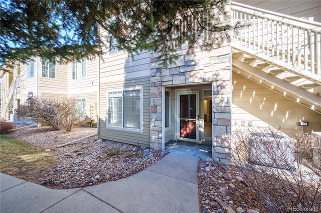 entrance to property with stone siding