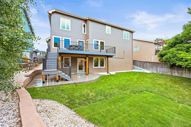 10235 Rustic Redwood Ln, Highlands Ranch, CO 80126 - back of house with a patio area, stairway, and a wooden deck