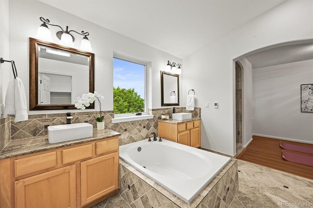 10235 Rustic Redwood Ln, Highlands Ranch, CO 80126 - full bath with two vanities and a garden tub