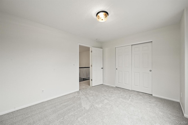 10235 Rustic Redwood Ln, Highlands Ranch, CO 80126 - unfurnished bedroom with carpet floors, baseboards, and a closet