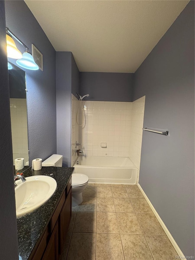 bathroom featuring toilet, visible vents, vanity, tile patterned floors, and washtub / shower combination