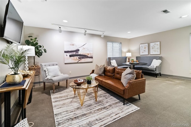 living room with carpet floors and track lighting