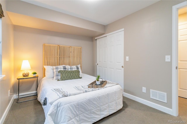 carpeted bedroom featuring a closet