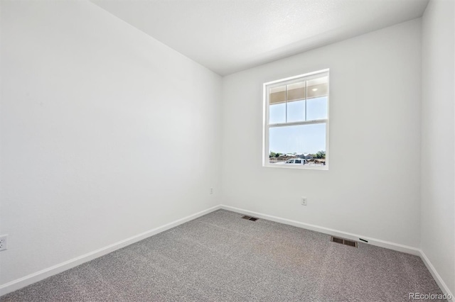 317 W Owen Ave, Keenesburg, CO 80643 - unfurnished room featuring baseboards and carpet floors
