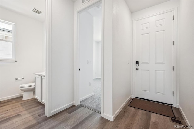 317 W Owen Ave, Keenesburg, CO 80643 - entryway with wood finished floors and baseboards